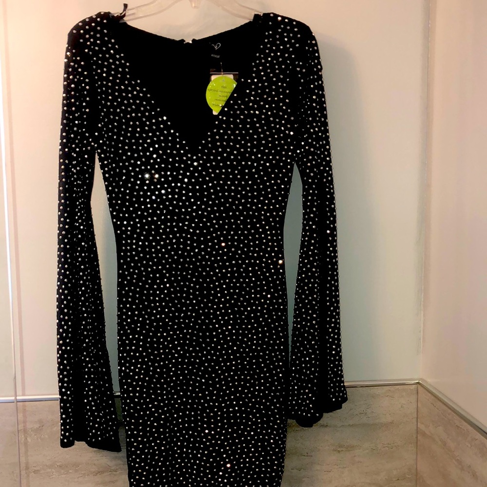 Black New dress with bell sleeves bodycon type